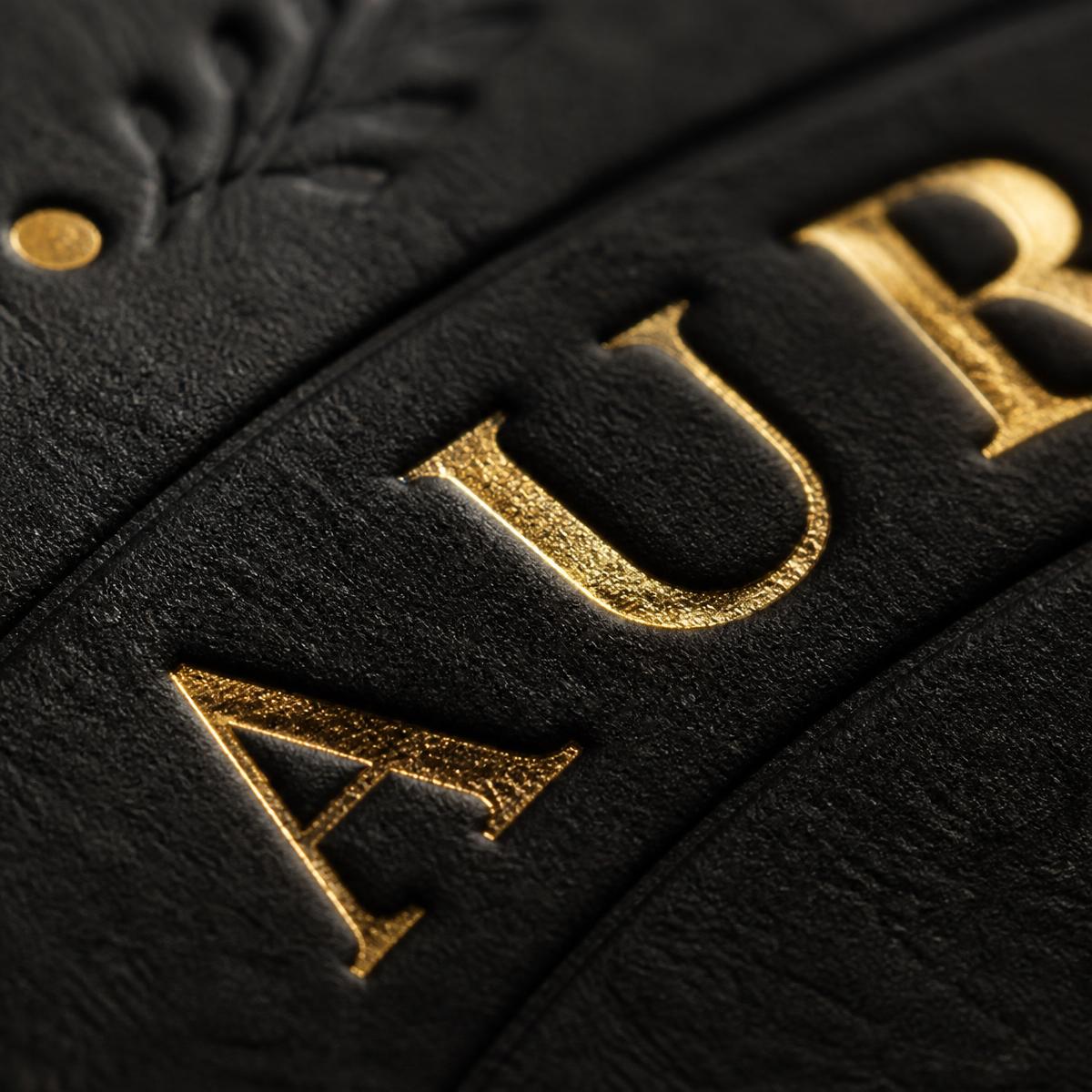 Macro detail of gold foil stamping on black board